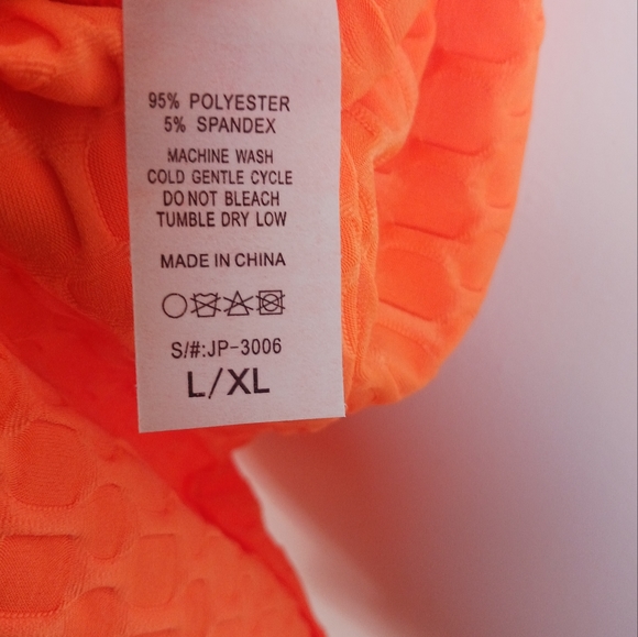 Neon Orange Criss Cross Textured Romper by SJL Apparel - Picture 6 of 7